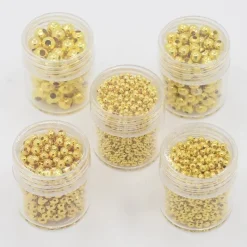 Tradera 5 boxar (ca 2355st) Distanspärlor Guld 5 storlekar 2-5mm^ Smyckestillverkning