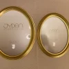 Tradera 2 stycken guldfärgade ovala Jyden ramar^ Ramar