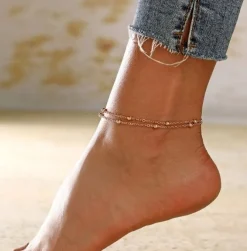 Tradera Fotlänkar<Fotsmycke Fotlänk Ankellänk Vristlänk Fotkedja guldig färg trendi