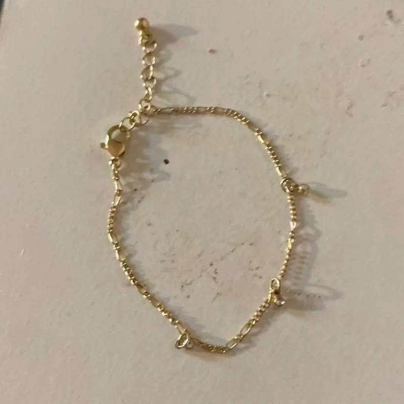 Tradera Armband<Guldigt armband