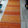 Tradera Lång orange handvävd trasmatta^ Mattor
