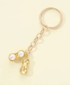 Tradera Ny i sealad förpackning- Guldförgylld Rolig nyckelring med jordnöt & 2 vita pär> Nyckelringar & Nyckelfodral