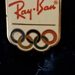 Tradera Olympia<Säljer en Ray-Ban Olympisk Reklampins
