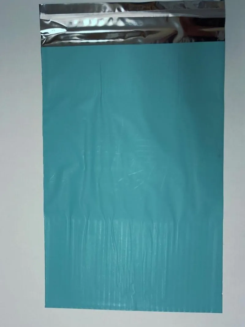 Tradera Frakt & Förpackning<50st Foliepåse 27x40+5cm med tejpförslutning , ljusblå / turkos, presentpåse