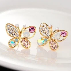 Tradera Örhängen<Unika Guld Stud Örhängen - Glittrande Fjärilar med Rhinestones i Olika Färger