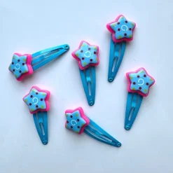 Tradera Varupartier<VARUPARTI 40 st - Hårspännen i blått och rosa med stjärna Lollipop till barn